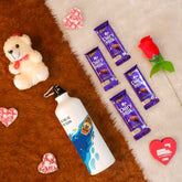 Valentine Gift Hamper with 'Be The Ocean' Printed Water Bottle (750ml), Teddy Bear Toy, Red Rose, Greeting Card, and 4 Dairy Milk Chocolates