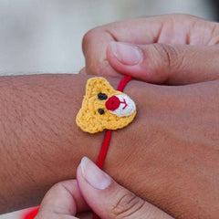 Dhavala, Teddy Bear, Teddy Bear with Bow, Swastika, Sun, Maati and Neel Nazar Battu Eco-friendly Seed Rakhi (Set of 7)