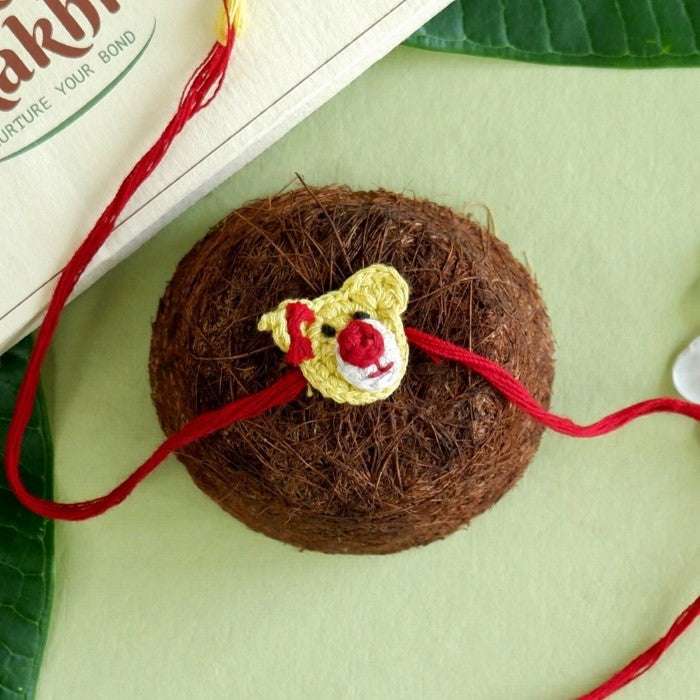 Dhavala, Teddy Bear, Teddy Bear with Bow, Swastika, Sun, Maati and Neel Nazar Battu Eco-friendly Seed Rakhi (Set of 7)