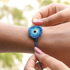Dhavala, Teddy Bear, Teddy Bear with Bow, Swastika, Sun, Maati and Neel Nazar Battu Eco-friendly Seed Rakhi (Set of 7)