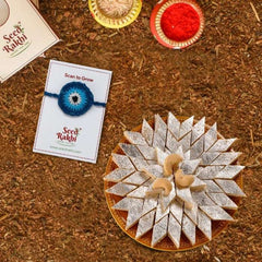 Neel Nazar Battu Seed Rakhi Gift Hamper With Kaju Katli Mini Bites 125 gm