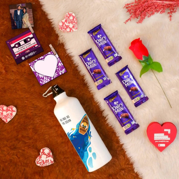 Valentine Gift Hamper with 'Be The Ocean' Printed Water Bottle (750ml), Set of 2 Clip Magnets, Red Rose, Greeting Card &amp; 4 Dairy Milk Chocolates