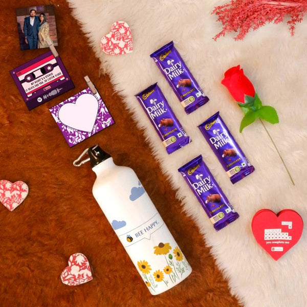 Valentine Gift Hamper with 'Be Happy' Printed Water Bottle (750ml), Set of 2 Clip Magnets, Red Rose, Greeting Card &amp; 4 Dairy Milk Chocolates